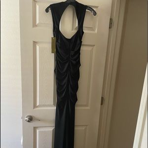 Brand new black long evening dress! Beautiful, and very flattering. Size 2
